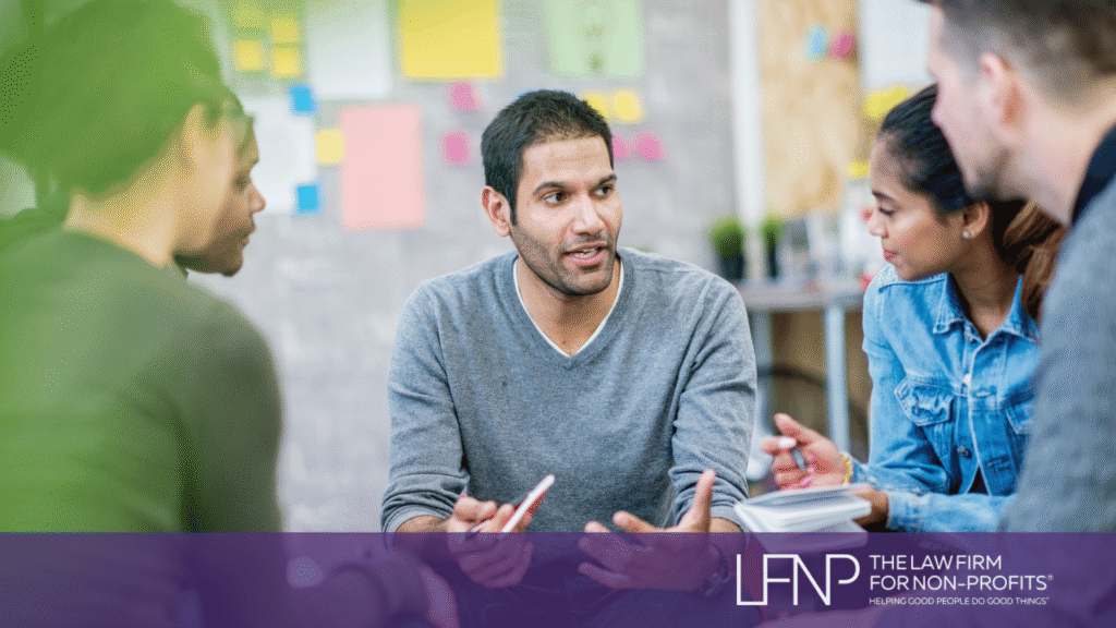 Nonprofit board members and staff engaged in a collaborative discussion about public charity governance and IRS public support requirements.